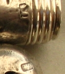 silver acorn containing a cigarette-holder