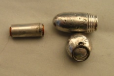 silver acorn containing a cigarette-holder