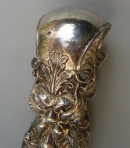 Austrian antique silver sugar tongs with masks and floral motifs