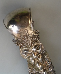 Austrian antique silver sugar tongs with masks and floral motifs