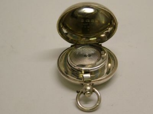silver sovereign holder in watch shape