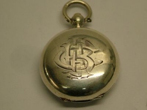 silver sovereign holder in watch shape