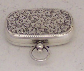 silver sovereign holder in locket shape