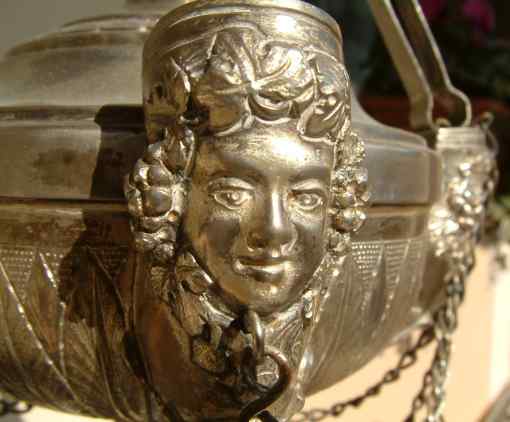 oil lamp female head on reservoir supporting hanging chains