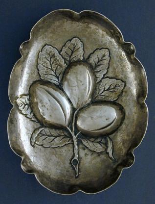 upper face of repoussé silver sweetmeat dish